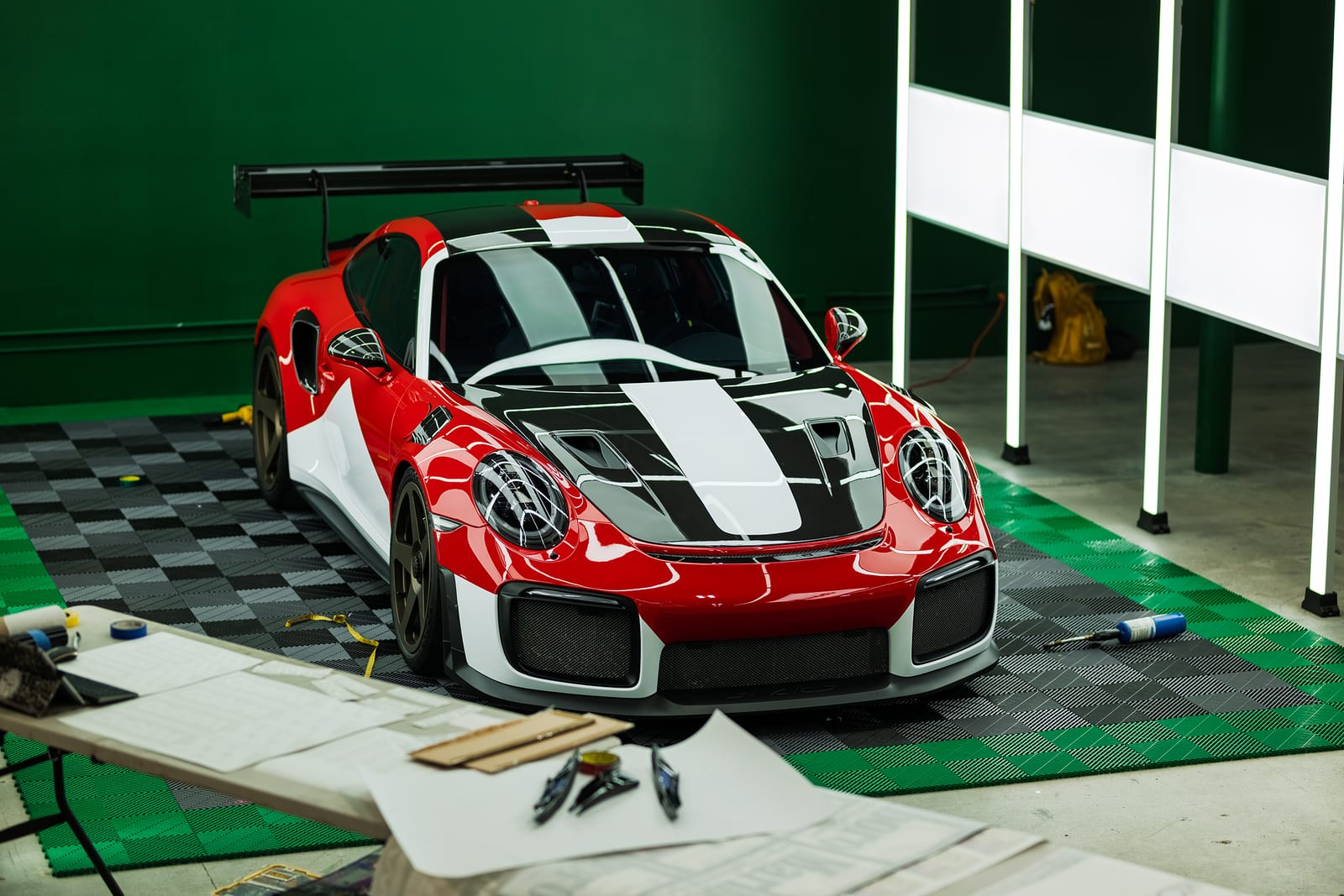 Custom livery detail on the door of a wrapped Porsche GT2 RS at WRPD